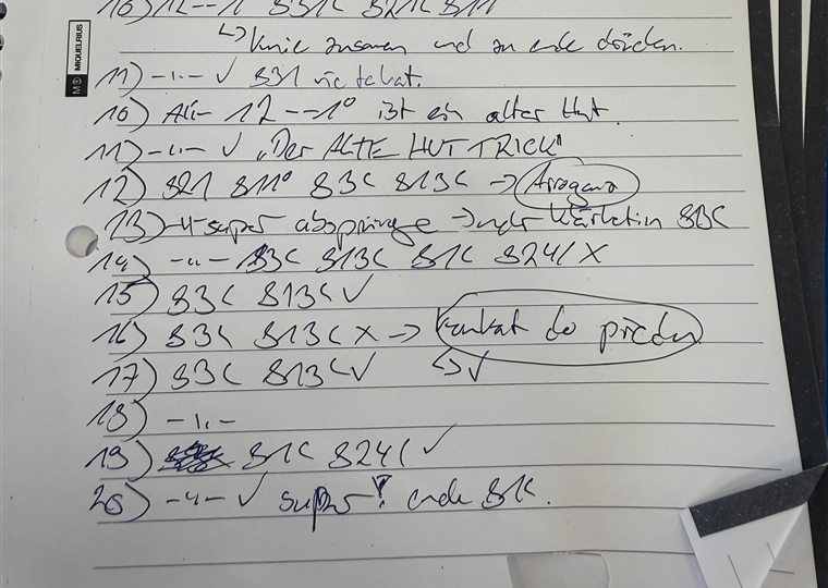 A handwritten trampoline training notebook with skill codes and notes